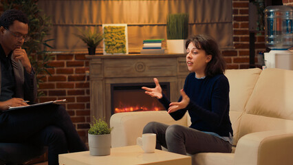 Displeased woman complaining about relationship conflict, talking to psychologist about problems at...