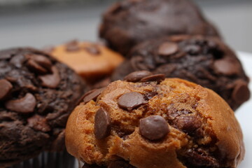 delicious muffins for dessert, small cakes with chocolate chips, image of delicious dessert