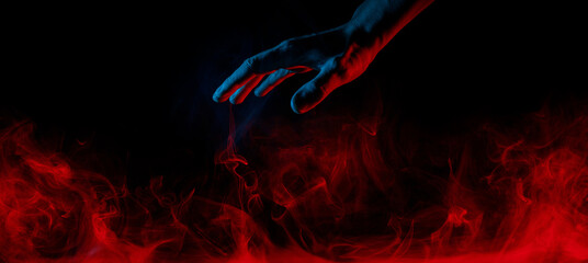 A scary hand on dark background. Mysterious composition. Fortune teller, mind power, prediction,...
