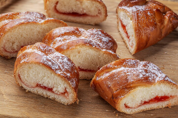 Sweet homemade freshly baked bun on the table. Close-up.