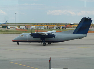 Two-Propeller Commercial Aircraft Heading Out For Takeoff