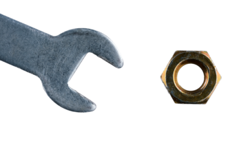 metal wrench and yellow metal nut isolated  