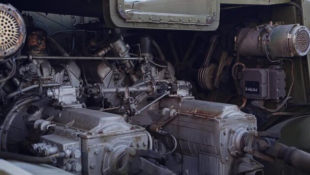 Internal parts and the engine of an old military tractor. Shooting in the parking lot of old military vehicles