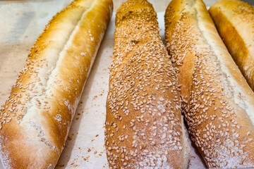 Fresh tasty baguette with sesame seeds.