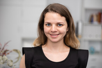 Portrait of smiling business woman in a modern office