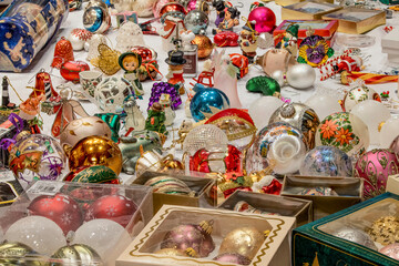 Fototapeta na wymiar Christmas decorations on table ready to hang on Christmas tree.