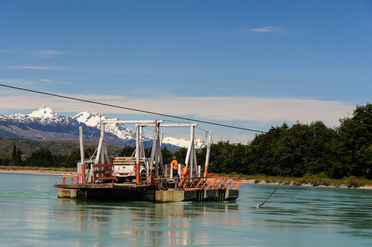 Chile, Aysen. Cable ferry (Balsa) transporting a truck across the Baker River.