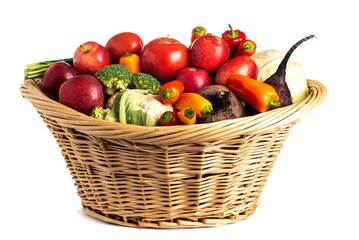 Assorted organic vegetables and fruits in wicker basket isolated on white background.