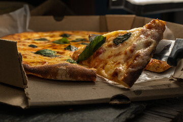 stone pizza with mozzarella cheese with tomato and basil