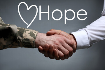 Concept of hope. Soldier and man shaking hands against grey background, closeup