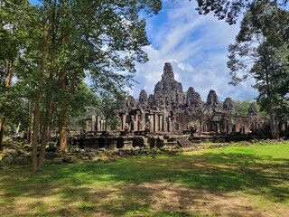 Fototapeta na wymiar The Bayon is a richly decorated Khmer temple related to Buddhism at Angkor in Cambodia. The Bayon stands at the centre of Jayavarman's capital, Angkor Thom.