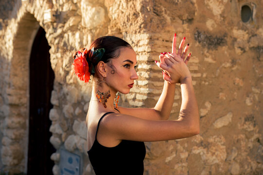 Portrait of a woman dancing flamenco at sunset