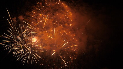4k. Bright New Year's fireworks 2023. beautiful new year's eve. glowing loop christmas bokeh....