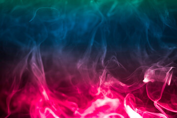 Fototapeta na wymiar Colorful smoke on a black background. Rainbow abstract light texture smoke background.