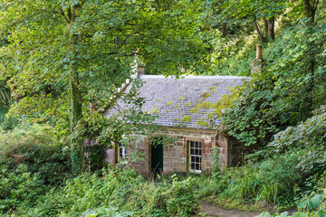 Fototapeta na wymiar Old stone house in the forest