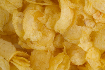 Texture of golden chips. Closeup. View from above