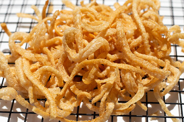 Crispy pork rinds or pork snack.