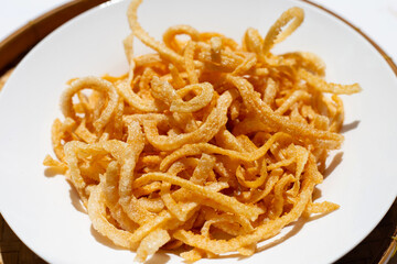 Crispy pork rinds or pork snack.