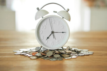 count down time for save salary money on stack coins at home blur background