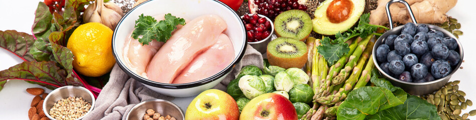 ..Healthy food background. Fresh vegetables, fruits and chicken meat.