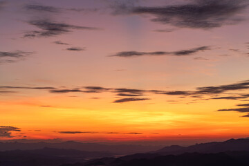 Sunset or sunrise mountain peaks colorful sky. Colorful Sky At Sunset Dawn Sunrise. Sun Over Skyline, Horizon. Warm Colours.