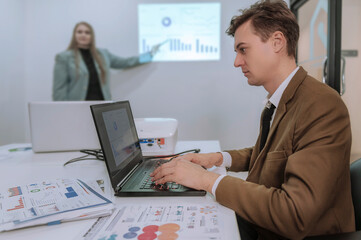 Manager is checking work in the office