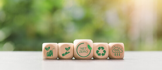 Wooden blocks and icons representing the concept of caring for nature together,Net Zero,Carbon...