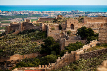 castle of sagunt in spain with port city and ocean background - obrazy, fototapety, plakaty
