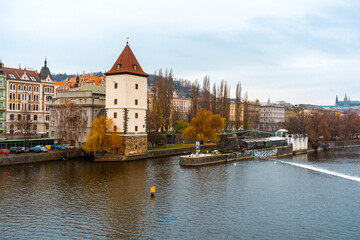 Fototapeta premium Beautiful view of Prague along Vltava River . Historic and romantic old town during winter . Prague , Czech : December 12 , 2019
