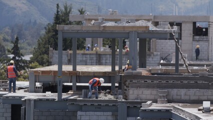 construction site workers  crane movement building builders