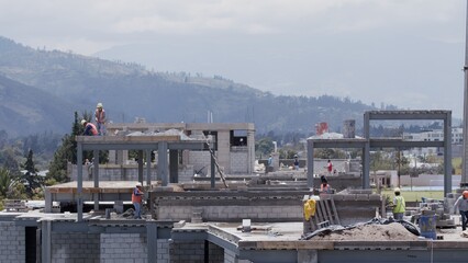 construction site workers  crane movement building builders