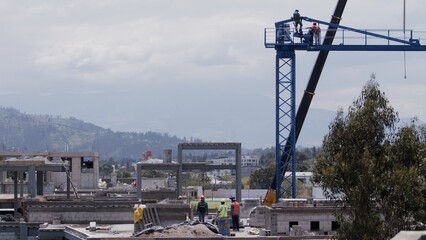 construction site workers  crane movement building builders