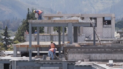 construction site workers  crane movement building builders