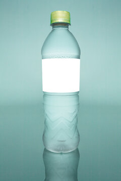 Pack Shot Of Water Bottle With Empty Label Teal Background