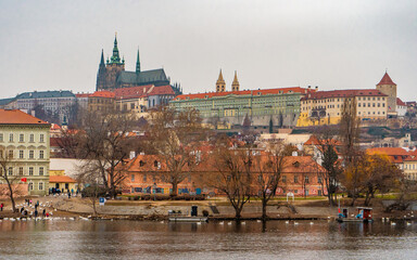 Obraz premium Beautiful view of Prague , Historic and romantic old town along Vltava River near Charles bridge during winter . Prague , Czech : December 12 , 2019