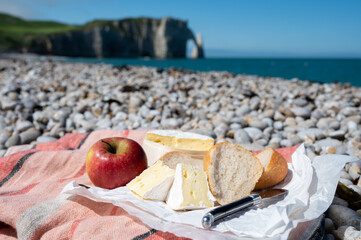 Lunch with french round camembert cow cheese from Calvados region, fresh baked baguette bread and...