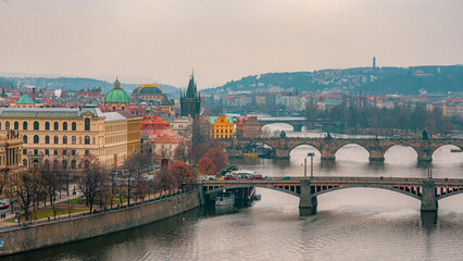 Fototapeta premium Beautiful view , cityscape and bridges at Letna park at Letna hill in Prague old town , along the Vltava River during winter . Prague , Czech : December 12 , 2019