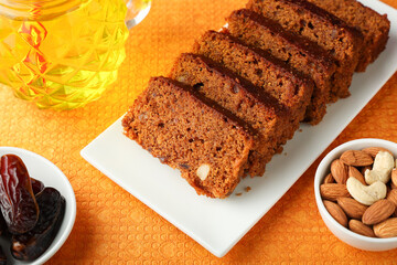 Carrot and dates cake made dried fruit, raisins, cashew nuts almond. Tasty home made flavored cinnamon , spices Christmas new year Kerala India Sri lanka. Sweet dessert food.
