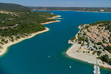 Fototapeta na wymiar Aerial view on blue lake Sainte-Croix-du-Verdon and villages on cliffs, tourists destination in France