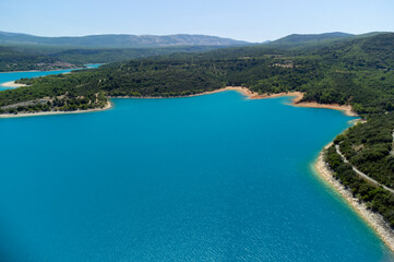 Aerial view on blue lake Sainte-Croix-du-Verdon and villages on cliffs, tourists destination in...
