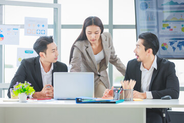 Obraz premium Millennial Asian cheerful happy professional successful male businessman and female businesswoman colleague in formal suit smiling brainstorming discussing talking in company office meeting room.