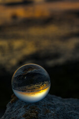 The reflection on crystal ball during sunset