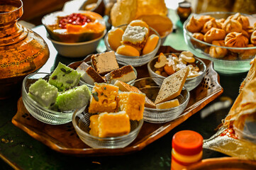Indian Traditional Sweets For Holidays and Festivals. Beautiful glass bowl.  Wooden Tray. Fresh Happy Colors. Worship With Favourit Food of Main Hindu God and Goddess. Colorful Food Wallpaper 