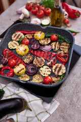 Grilled vegetables on grill pan at domestic kitchen