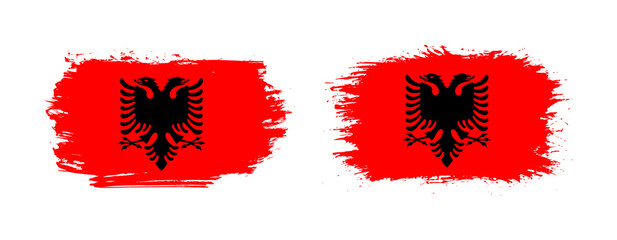Set of two grunge brush flag of Albania on solid background
