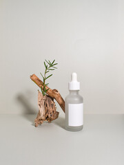 Obraz na płótnie Canvas Cosmetic bottle with driftwood.