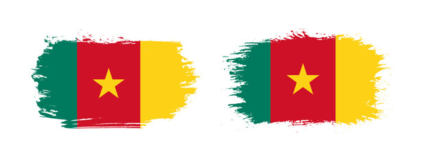 Set of two grunge brush flag of Cameroon on solid background