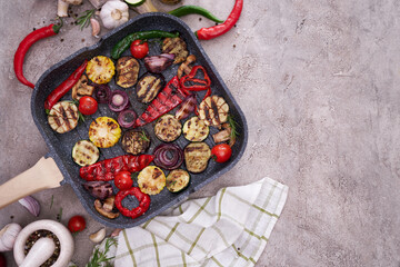 Grilled vegetables on grill pan at domestic kitchen