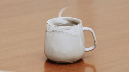 Served Smoking hot black specialty coffee on wooden table