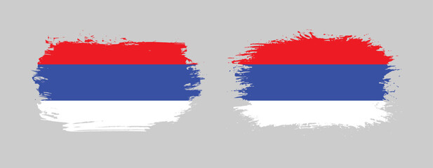 Set of two grunge brush flag of Republika Srpska on solid background